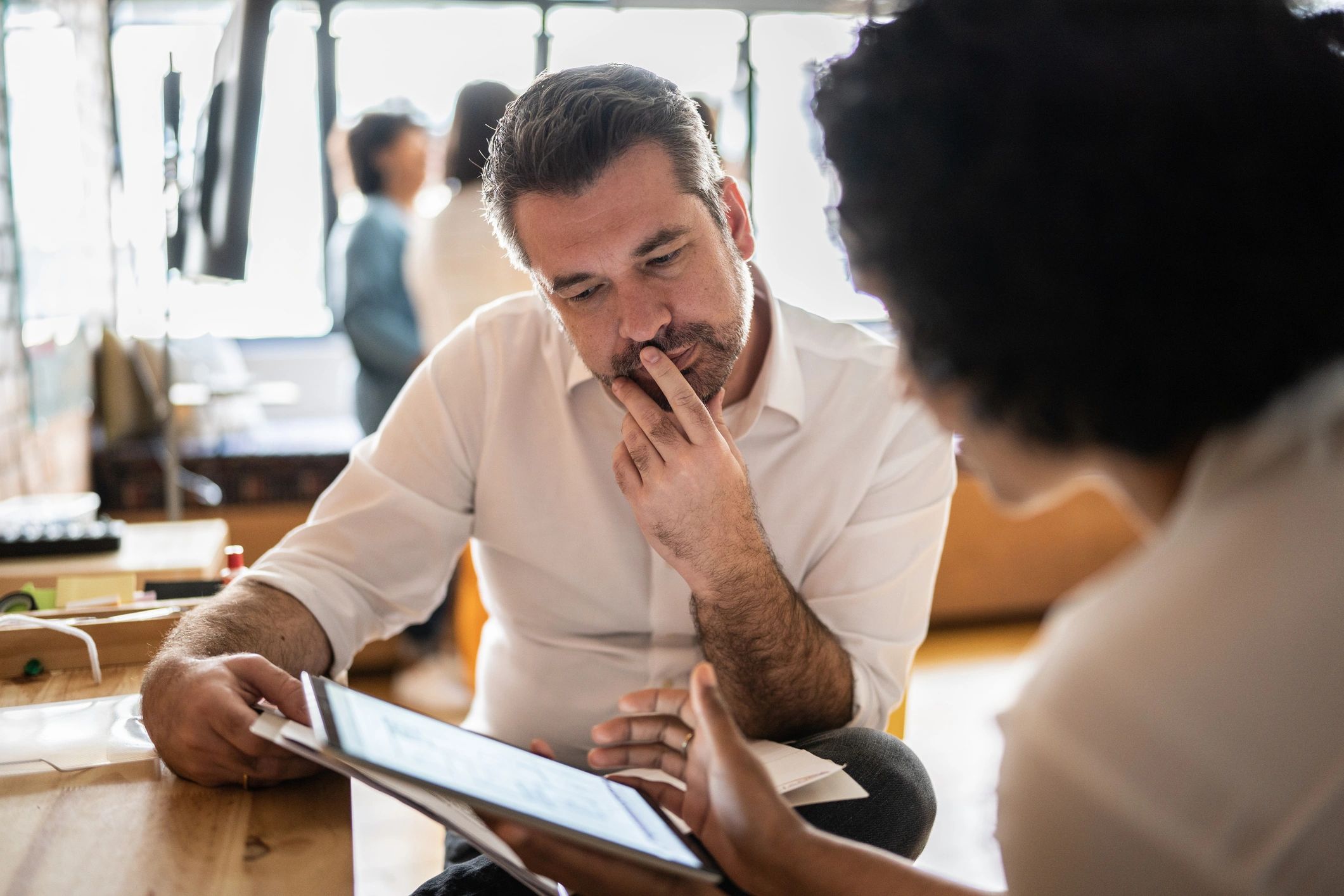 IT consultant reviewing a plan with a business leader