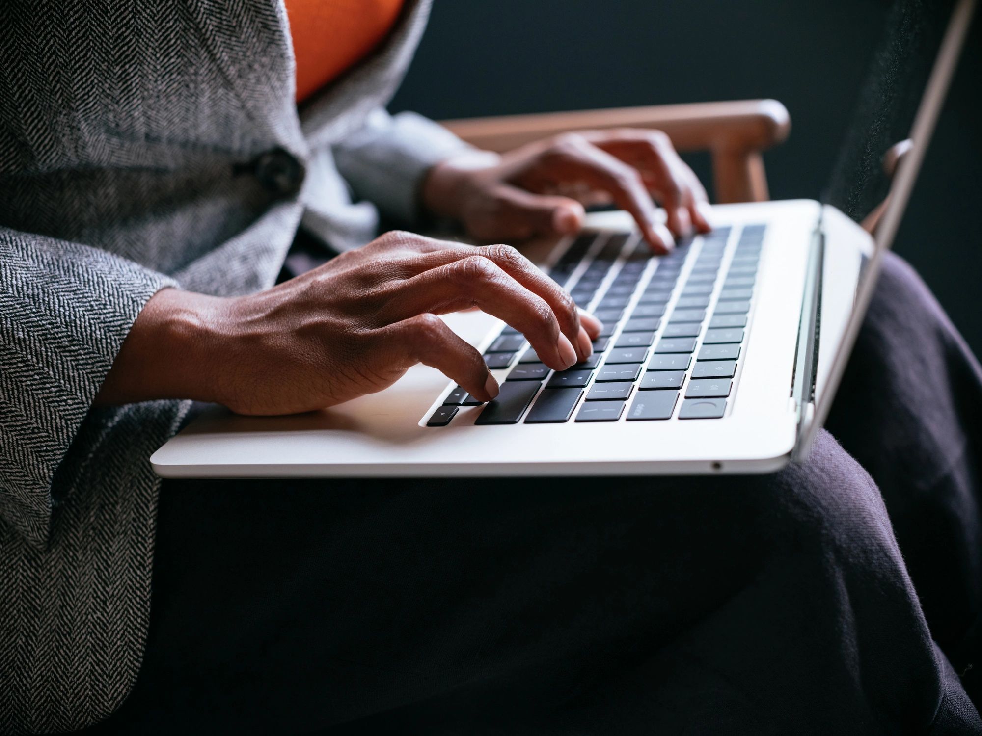 Professional working on a laptop in a modern workspace